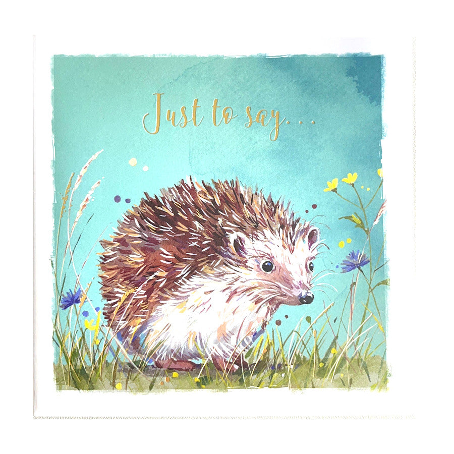 A beautiful notecard features a charming illustration of a hedgehog in a flower meadow, printed on high-quality cardstock. 